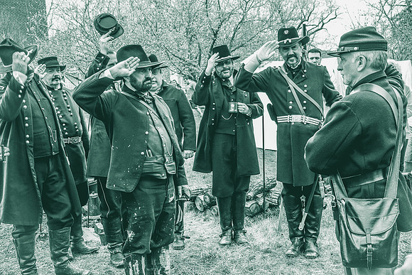 The promotion duly bestowed, General Grant and his high command salute the new Corporal
